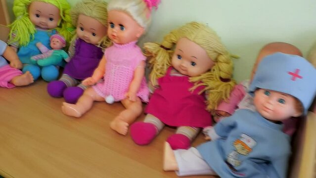 Many different dolls. The toys are cute in the nursery for children.