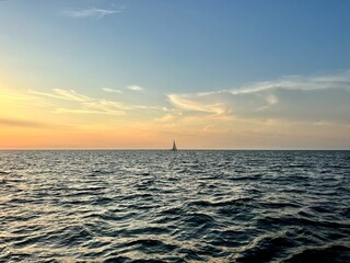 yacht in the sea at sunset