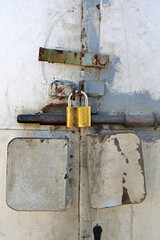 Mechanical Latch and Padlock at Double Metal Door Security