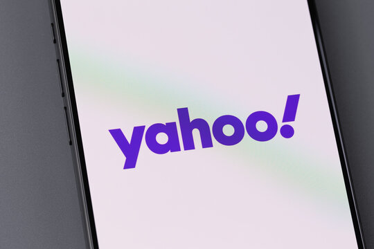 Yahoo logo mobile app on a screen smartphone. Yahoo is tech company, leader in search engine service and information technology web portals. Batumi, Georgia - December 15, 2023