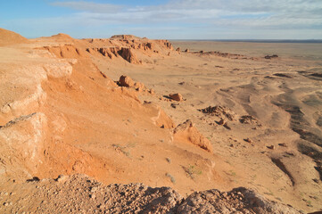 Fototapeta na wymiar View on Bayanzag Flaming Cliffs on the Mongolian Gobi desert containing fossils of jurassic dinosaurs