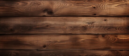 A closeup image showcasing a brown hardwood plank wall with a varnished finish. The pattern of the wood flooring is highlighted in this rectangle view