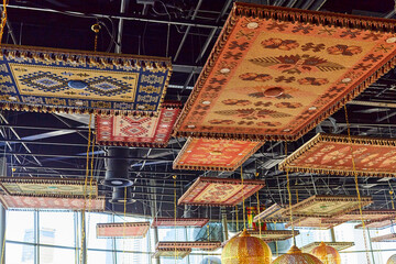 carpets used as decoration on the ceiling