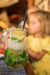 lime mint cocktail is on the table.