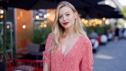 Elegant Woman Enjoying Evening at Outdoor Cafe