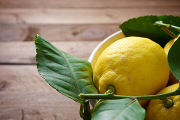 Lemons in a ceramic bowl - 770589815