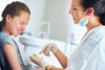 Child, checkup and dentist office for smile, teeth whitening or oral healthcare for cleaning with patient. Woman, girl or kid and happy for tooth, mouth and consultation for cavity or gingivitis