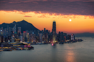 Crowded downtown and building in Hongkong Island during sunset in yellow color mood