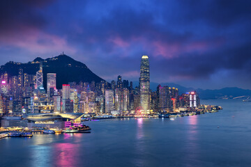 Crowded downtown and building in Hongkong Island during sunset in blue hour color mood