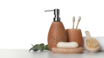 Bath accessories. Different personal care products and eucalyptus branch on table against white background. Space for text