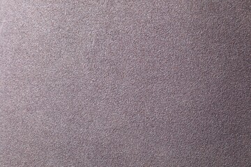 Texture of coarse sandpaper as background, top view
