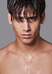 Obraz premium Man, portrait and skincare confidence in studio or healthy wellness on grey background for treatment, hygiene or mockup space. Male person, model and face or transformation, self care or wellbeing