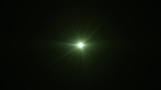 Abstract loop center glow gren star optical shine light lens flares flickering animation on black background. 