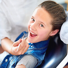 Girl, child and portrait at dentist for mouth with healthcare tool, consultation or dental inspection for oral health. Professional, kid patient or hand for teeth cleaning, gingivitis or medical care