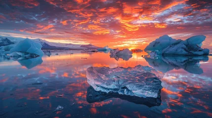 Foto op Plexiglas An evening photograph of the serene beauty of glaciers and icebergs in Iceland, with vibrant colors reflecting off their surfaces under an orange sunset sky © Kien