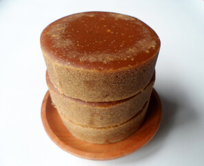 brown sugar or gula merah isolated on a white background	
