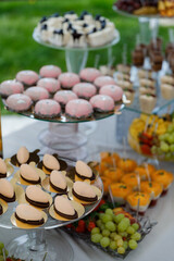 Abundance of desserts and cupcakes on table