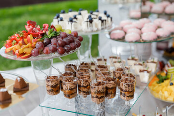 Dessert table filled with cupcakes and sweets