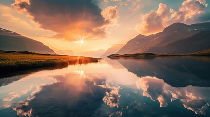 Breathtaking sunset over a serene lake with majestic mountains in the background and a perfect reflection on the water.