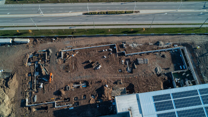 An aerial view looking down at a construction zone of a building being expanded