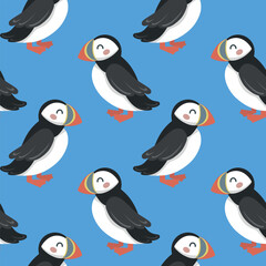 Seamless pattern with cute hand draw cartoon puffin on blue background. Design for printing, textile, fabric. Vector illustration