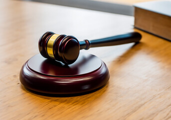 Close up Judge Gavel on a wooden table - 770649018