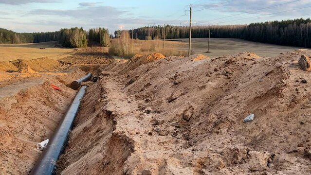 Natural Gas Pipeline Construction site, pipelayer. Transmission in pipe to LNG plant. Building of transit petrochemical pipe in field. Transports crude oil, natural gas, petroleum
