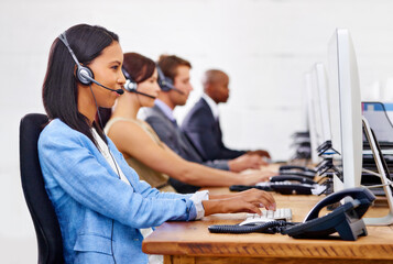 Call center, woman and consultant with computer for customer service with headset, microphone and...