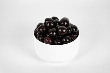 white cup with cherries