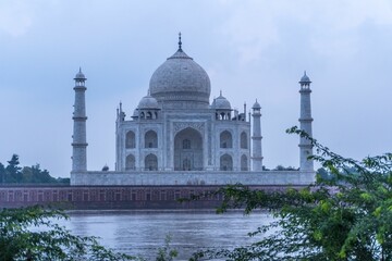 Stunning view of the Taj Mahal in Agra, India, with the River Yamuna visible in the foreground.