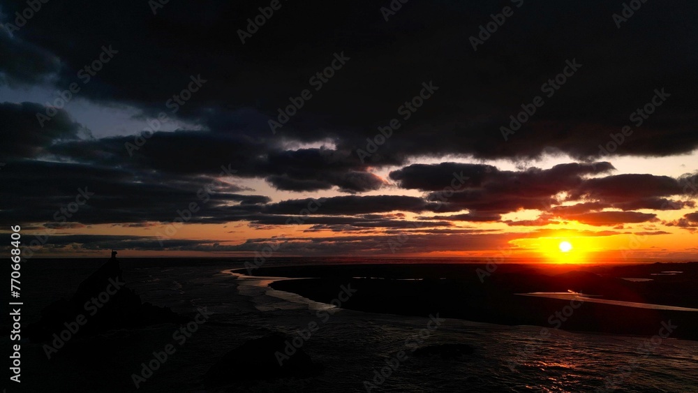 Wall mural Majestic sunset over the tranquil Whatipu Beach, Auckland, New Zealand - Wall murals
