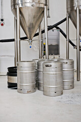 Steel tank, keg and beer production at brewery with equipment for process, factory and storage with...