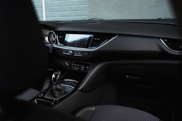 Stylish, spacious family car. Modern car interior, black perforated leather, aluminum, details...
