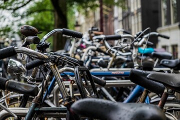 Outdoor scene of Amsterdam featuring numerous bicycles parked on the sidewalk.
