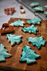 Christmas cookies in form of a Christmas tree with green batik pattern