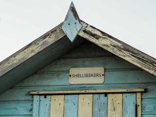 Aged wooden cabin with a word 