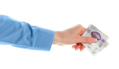 Female hand holding British pounds currency isolated on white background