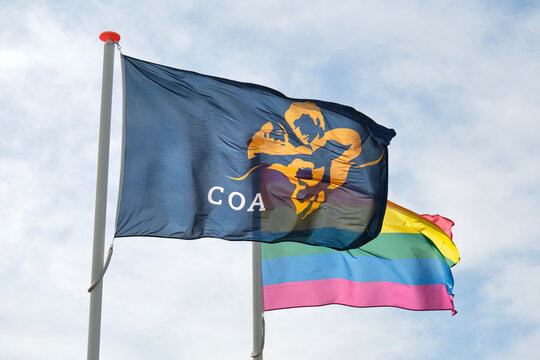  Flag of the COA and a rainbow flag at the entrance of a temporary housing location for asylum seekers or AZC in the Netherlands