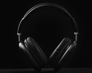 Fototapeta na wymiar Black headphone isolated on a black background.