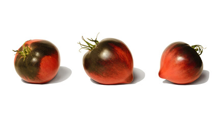 Three berries of the original tomato variety on white
