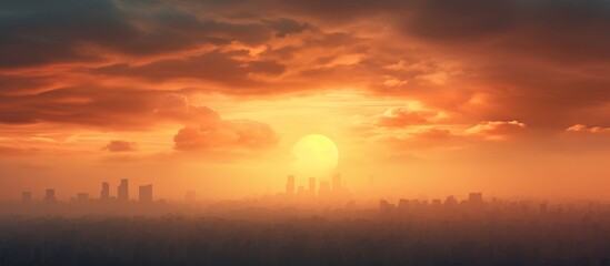 The orange and amber hues of the afterglow paint the sky as the sun sets over the distant city, creating a stunning natural landscape