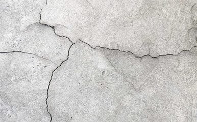Crack wall texture. Cracked concrete wall covered with cement surface as background. Wall fragment with scratches and cracks	

