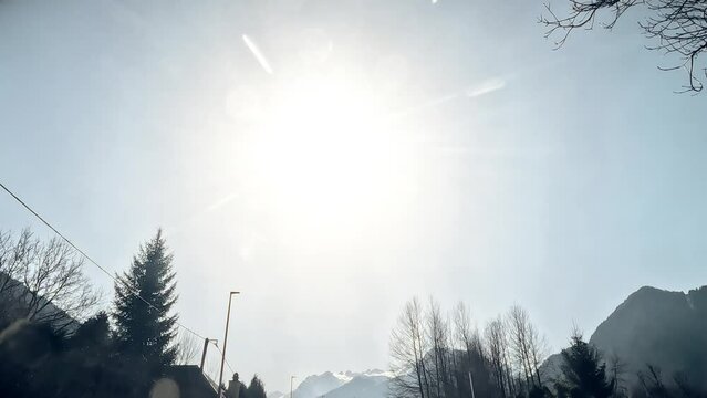 POV driving shot from the car moving in the French Alps in winter