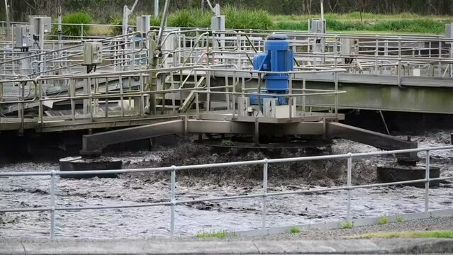 Sewage Water pump Machine Working on reservoir murky dirty water. modern sewer wastewater factory