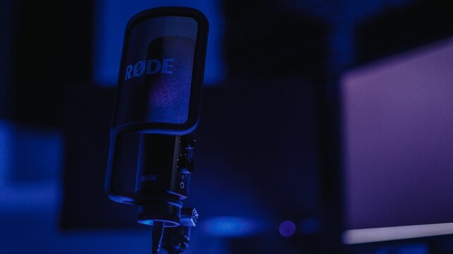 microphone in a recording studio at night with one of the microphones plugged up