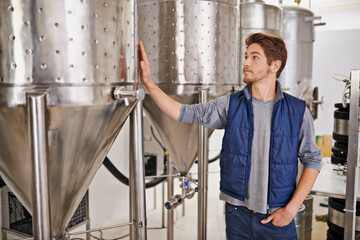 Beer, production and man with steel in factory or distillery for winery, alcohol and drink...