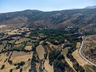 a mountain view, taken from above and a valley below