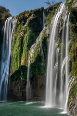 View of the Jiulong waterfall streaming down to a lake