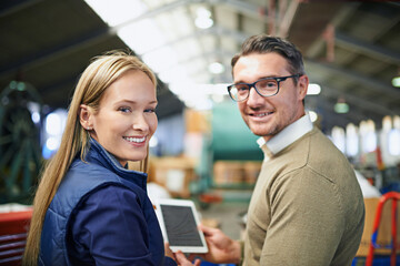 Business people, industry and portrait in warehouse with tablet for collaboration, ecommerce and distribution. Woman, man and smile with digital technology for supply chain, teamwork and inspection