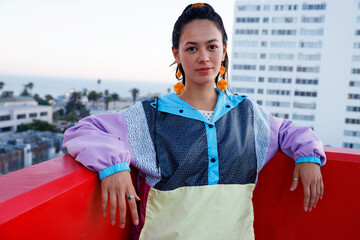 Fierce South American Woman Wearing Colorful Jacket in the Rooftop in a Late Afternoon. Escape Work...